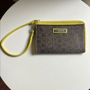 Calvin Klein Monogram Wristlet in Brown and Yellow/Lime